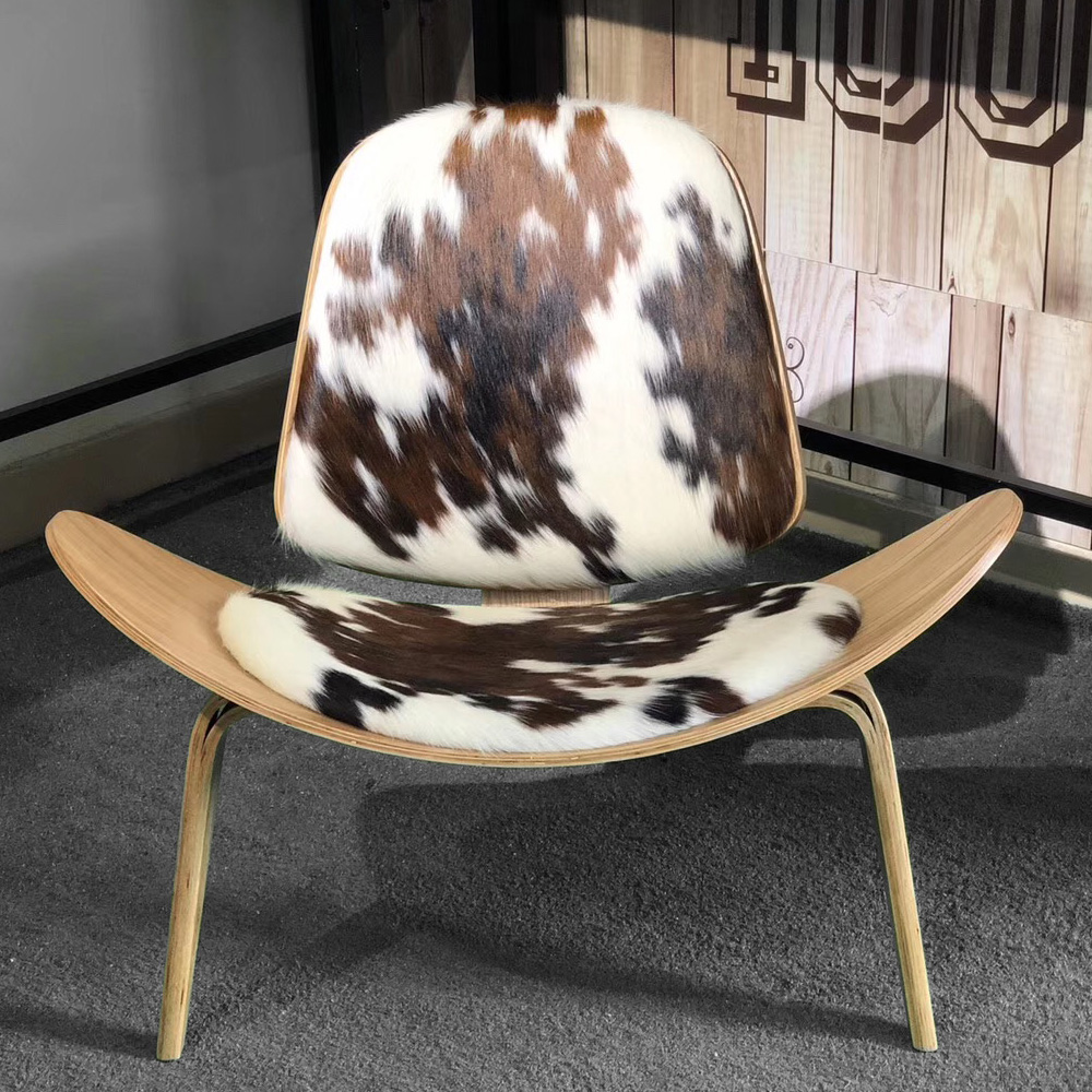 

Brown & White Cowhide Lounge Chair with Manchurian Ash Wood Base