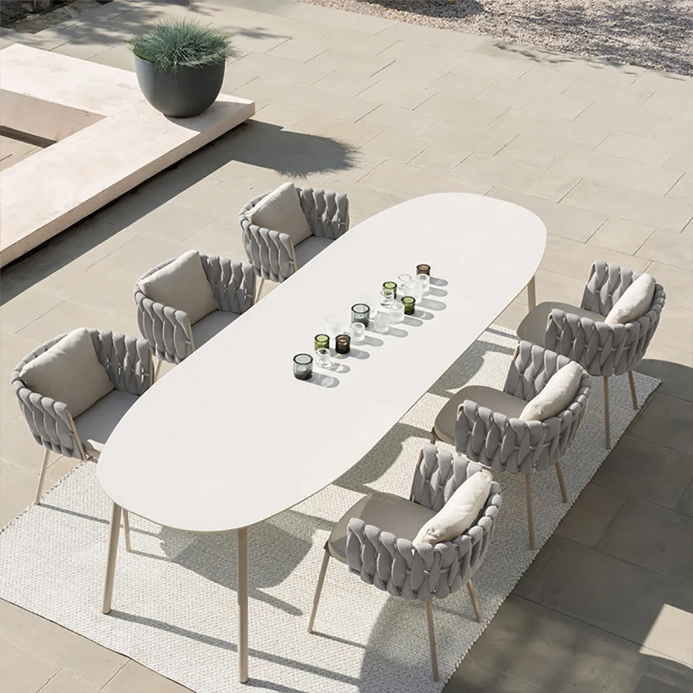 7 Pieces Outdoor Dining Set with Oval Marble-top Table and Rattan Woven Armchair
